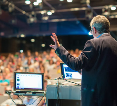 Man presenting at conference